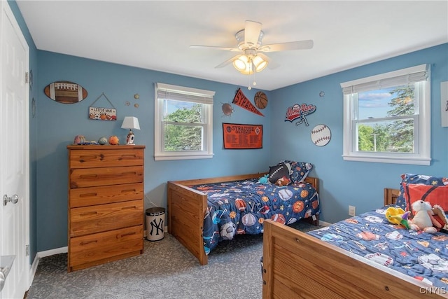 4956 Crestwood Ln, Onondaga, NY 13215 - carpeted bedroom featuring ceiling fan and baseboards