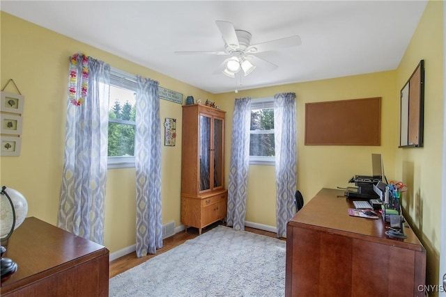 4956 Crestwood Ln, Onondaga, NY 13215 - home office with wood finished floors and a ceiling fan