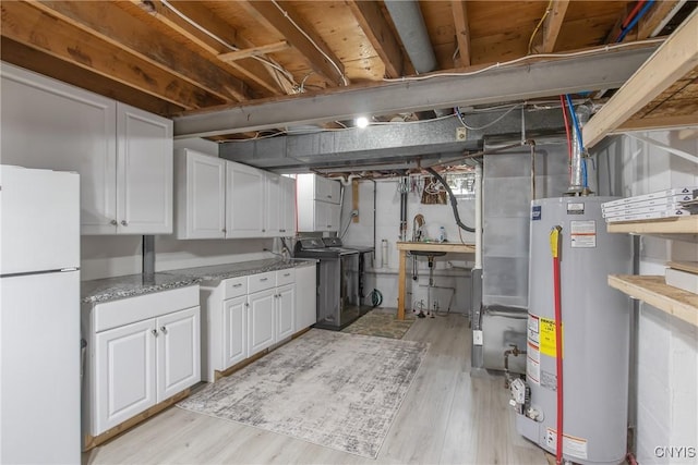 4956 Crestwood Ln, Onondaga, NY 13215 - unfinished below grade area with freestanding refrigerator, water heater, light wood-style floors, and heating unit