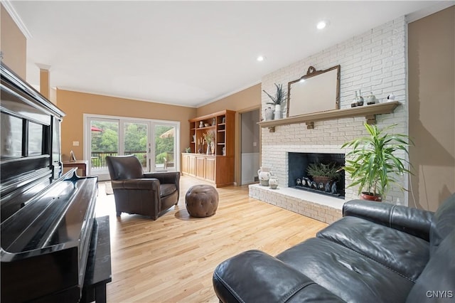 8067 Irish Mist Ln, Manlius, NY 13104 - living room with crown molding, a brick fireplace, wood finished floors, and recessed lighting