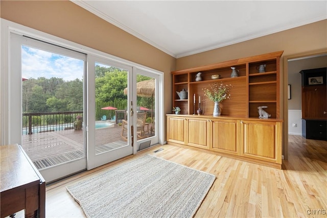 8067 Irish Mist Ln, Manlius, NY 13104 - doorway featuring crown molding and light wood-type flooring