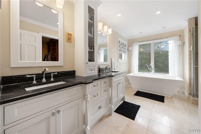 8067 Irish Mist Ln, Manlius, NY 13104 - full bath with ornamental molding, double vanity, a soaking tub, recessed lighting, and a shower stall