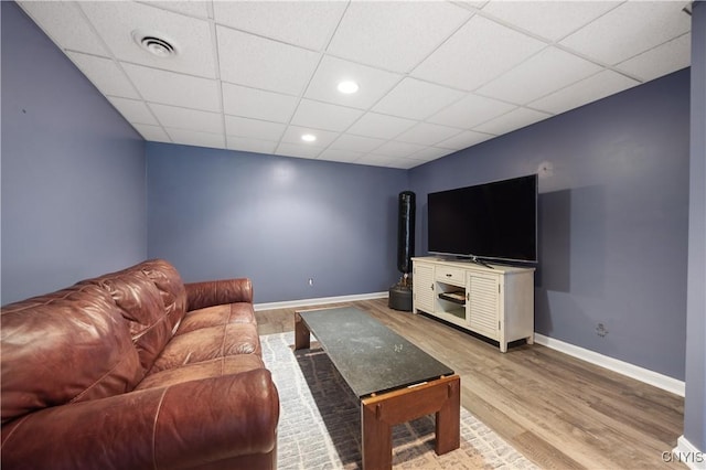 8067 Irish Mist Ln, Manlius, NY 13104 - living room with wood finished floors, a paneled ceiling, and recessed lighting