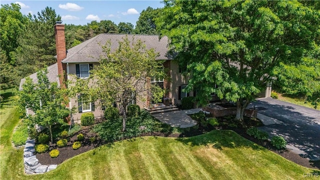 8067 Irish Mist Ln, Manlius, NY 13104 - obstructed view of property with a front lawn and a chimney