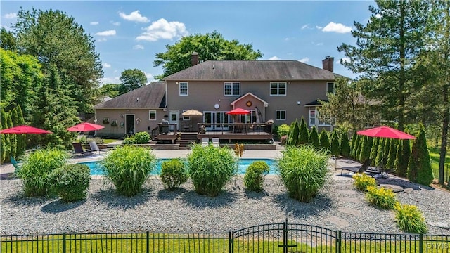 8067 Irish Mist Ln, Manlius, NY 13104 - back of property with a wooden deck and a chimney