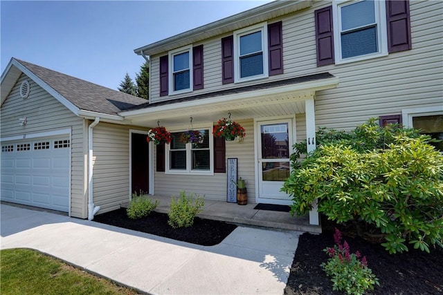 11 Hillcrest Dr, Hamlin, NY 14464 - traditional-style house with covered porch, an attached garage, a shingled roof, and concrete driveway