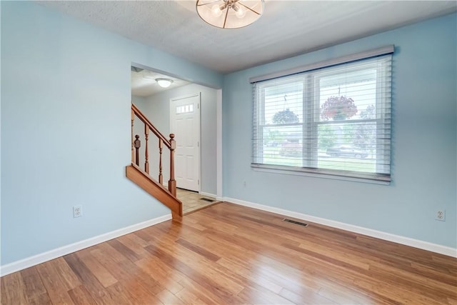 11 Hillcrest Dr, Hamlin, NY 14464 - foyer featuring stairway and light wood-style floors