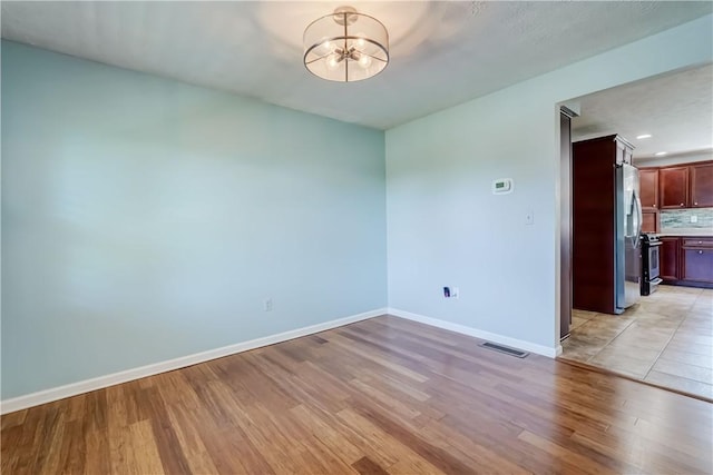 11 Hillcrest Dr, Hamlin, NY 14464 - unfurnished room with a chandelier, light wood finished floors, and recessed lighting
