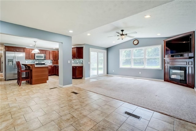 11 Hillcrest Dr, Hamlin, NY 14464 - unfurnished living room featuring ceiling fan, lofted ceiling, light tile patterned floors, recessed lighting, and light colored carpet