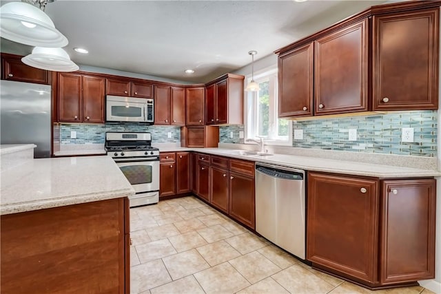 11 Hillcrest Dr, Hamlin, NY 14464 - kitchen featuring stainless steel appliances, pendant lighting, decorative backsplash, recessed lighting, and light tile patterned floors