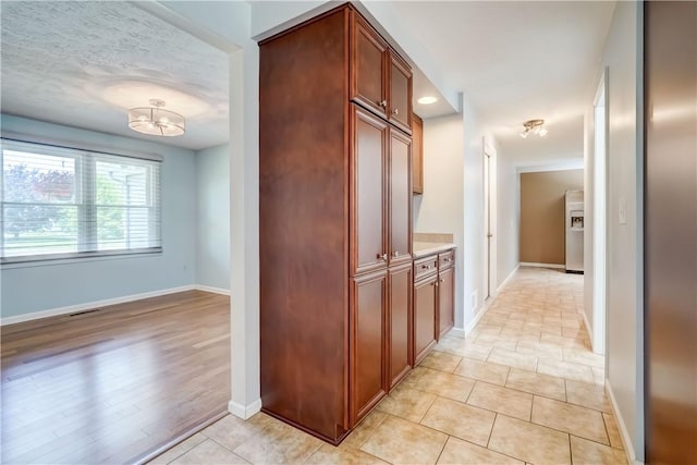 11 Hillcrest Dr, Hamlin, NY 14464 - hall featuring a chandelier and light tile patterned floors