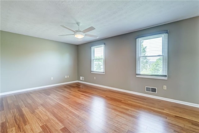 11 Hillcrest Dr, Hamlin, NY 14464 - spare room featuring light wood finished floors, ceiling fan, and a textured ceiling