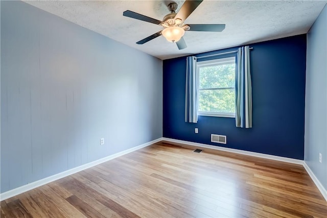 11 Hillcrest Dr, Hamlin, NY 14464 - unfurnished room with wood finished floors, a textured ceiling, and ceiling fan