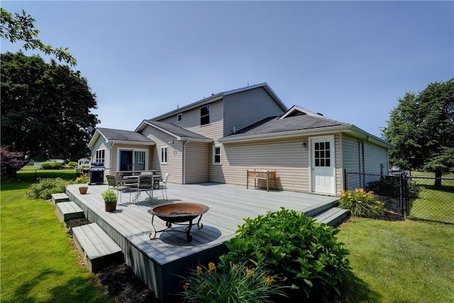 11 Hillcrest Dr, Hamlin, NY 14464 - rear view of property with a fire pit and a deck
