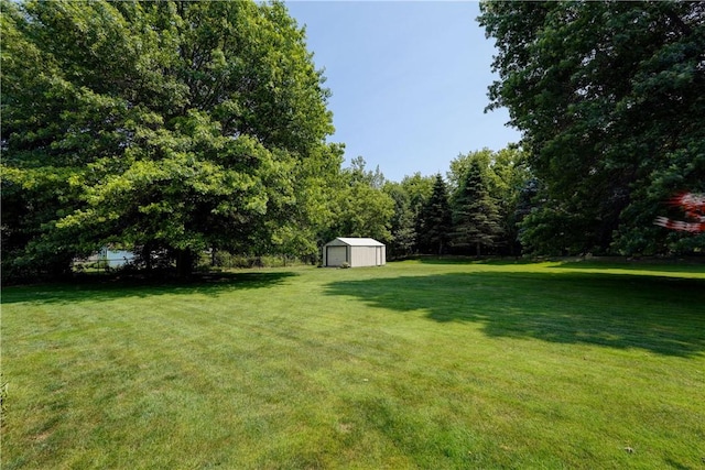 11 Hillcrest Dr, Hamlin, NY 14464 - view of green lawn with a storage unit