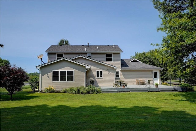 11 Hillcrest Dr, Hamlin, NY 14464 - back of property featuring a lawn and a patio area