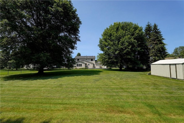 11 Hillcrest Dr, Hamlin, NY 14464 - view of green lawn with an outbuilding and an outdoor structure