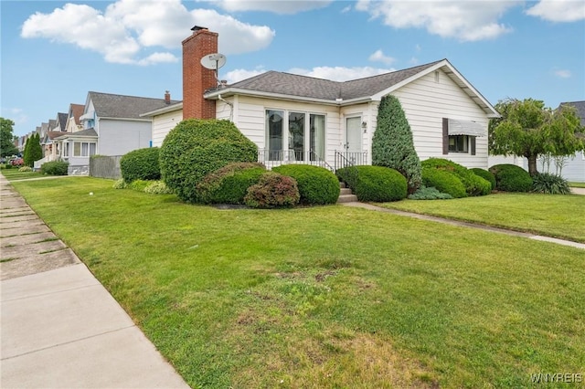 66 Gierlach St, Cheektowaga, NY 14212 - view of side of home featuring a lawn and a chimney
