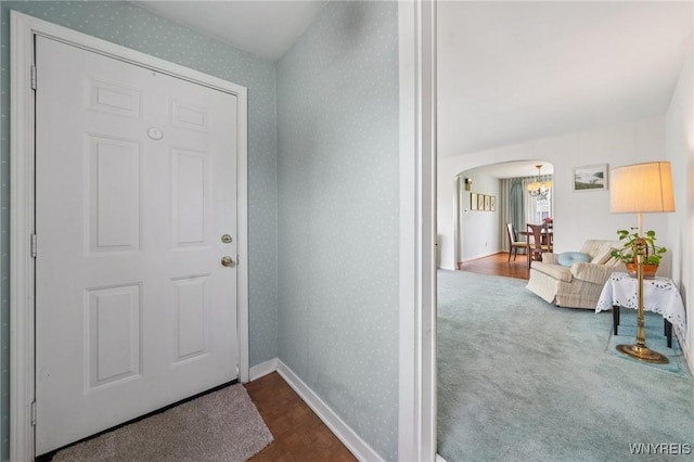 66 Gierlach St, Cheektowaga, NY 14212 - entrance foyer featuring wallpapered walls, arched walkways, and a chandelier