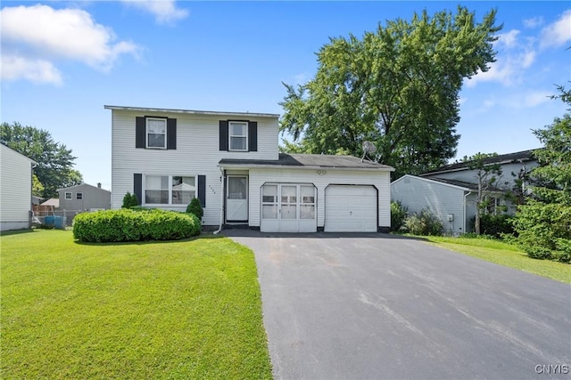 5539 Taormina Dr, Clay, NY 13041 - traditional home with an attached garage, driveway, and a front lawn