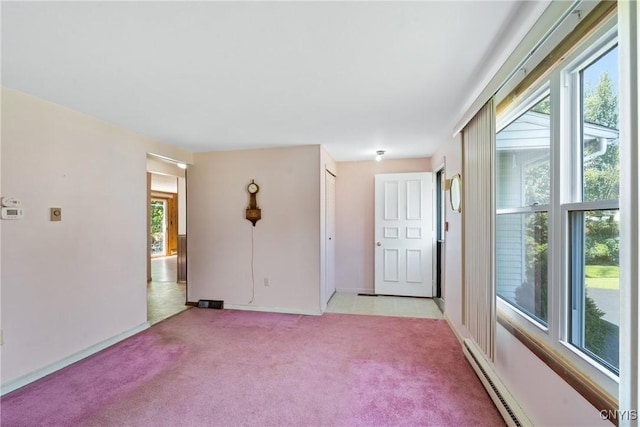 5539 Taormina Dr, Clay, NY 13041 - empty room featuring light carpet and baseboard heating