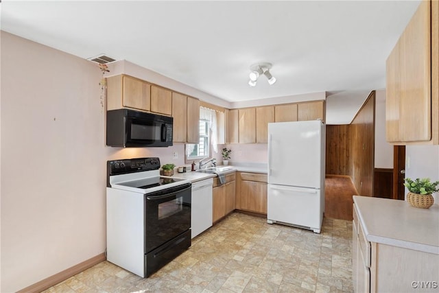 5539 Taormina Dr, Clay, NY 13041 - kitchen with black appliances, light brown cabinets, light countertops, and stone finish flooring