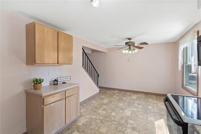 5539 Taormina Dr, Clay, NY 13041 - kitchen featuring ceiling fan, stainless steel electric stove, light brown cabinetry, and light countertops