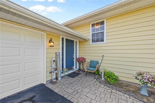 7980 Cedarwood Dr, Rome, NY 13440 - view of exterior entry with an attached garage