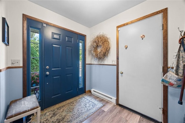 7980 Cedarwood Dr, Rome, NY 13440 - entrance foyer with a baseboard radiator and wood finished floors