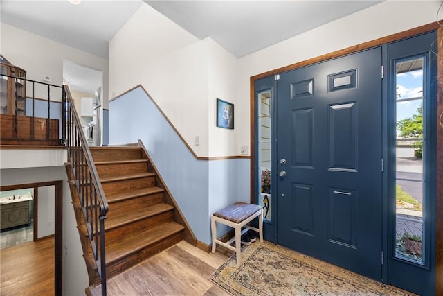 7980 Cedarwood Dr, Rome, NY 13440 - entrance foyer with wood finished floors and stairs