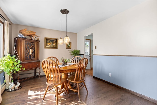 7980 Cedarwood Dr, Rome, NY 13440 - dining room with wood finished floors and a baseboard radiator