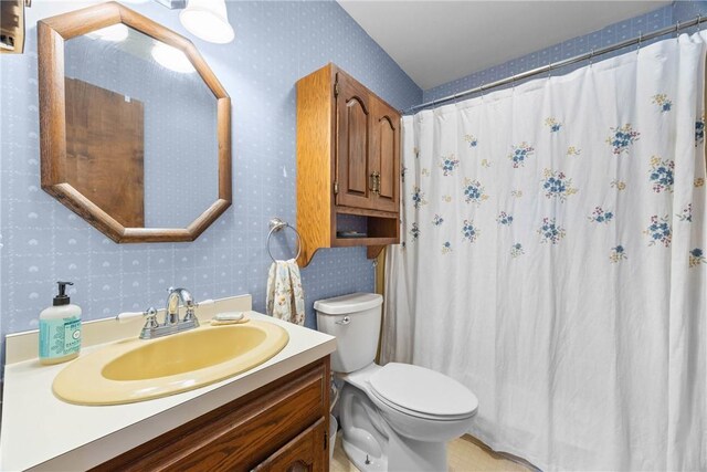 7980 Cedarwood Dr, Rome, NY 13440 - full bath featuring wallpapered walls, vanity, and a shower with curtain