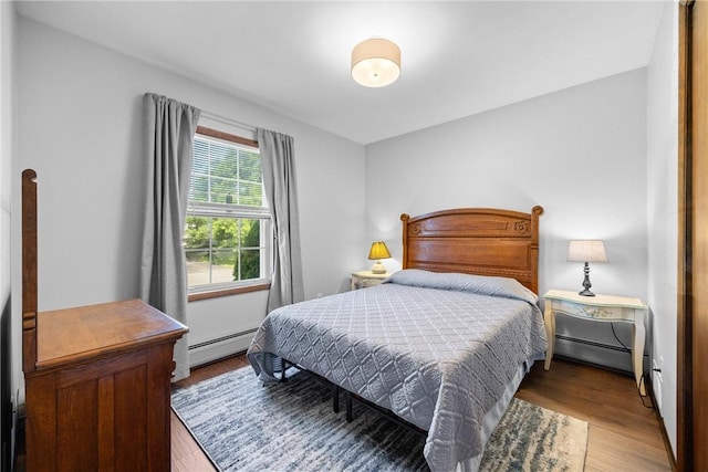7980 Cedarwood Dr, Rome, NY 13440 - bedroom featuring wood finished floors and a baseboard heating unit