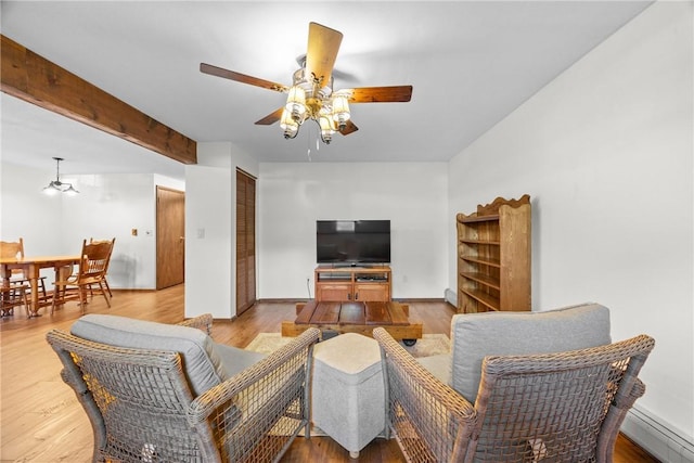 7980 Cedarwood Dr, Rome, NY 13440 - living room with a ceiling fan, wood finished floors, and a baseboard radiator