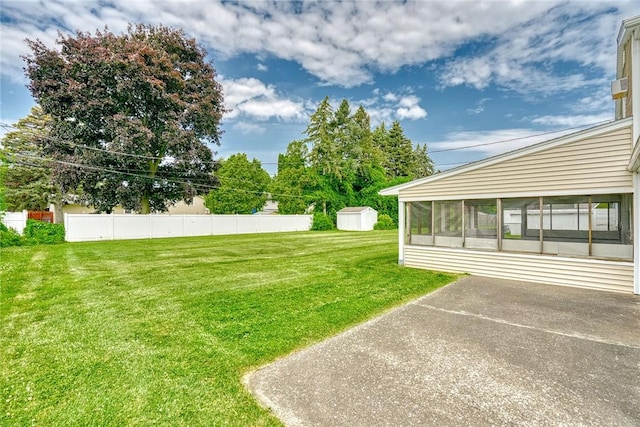 163 Auramar Dr, Irondequoit, NY 14609 - view of grassy yard with a sunroom and a storage unit