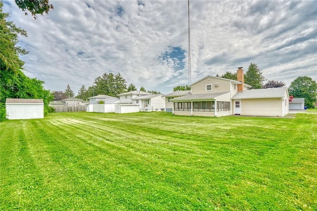 163 Auramar Dr, Irondequoit, NY 14609 - view of yard with a sunroom and a shed