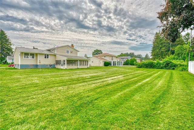 163 Auramar Dr, Irondequoit, NY 14609 - view of green lawn featuring a sunroom