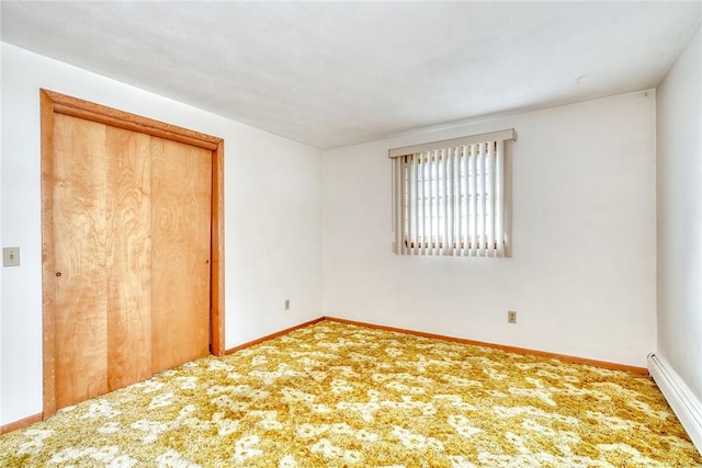 163 Auramar Dr, Irondequoit, NY 14609 - unfurnished bedroom with a baseboard radiator, a closet, and carpet flooring