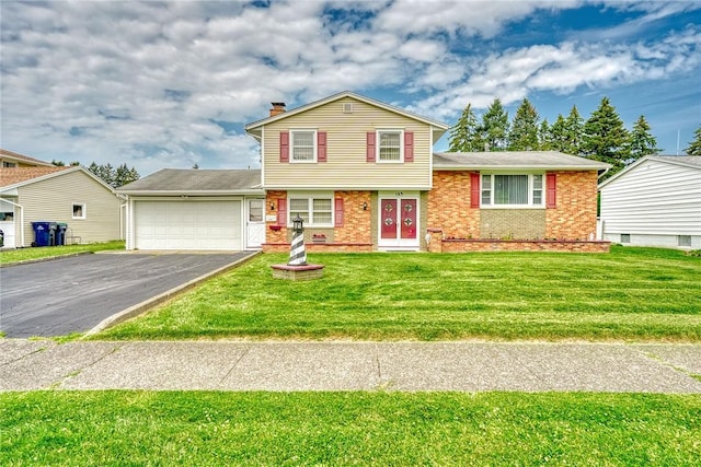 163 Auramar Dr, Irondequoit, NY 14609 - split level home with asphalt driveway, a chimney, a garage, and a front yard