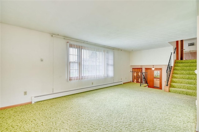 163 Auramar Dr, Irondequoit, NY 14609 - unfurnished living room with a baseboard heating unit, carpet floors, and stairs