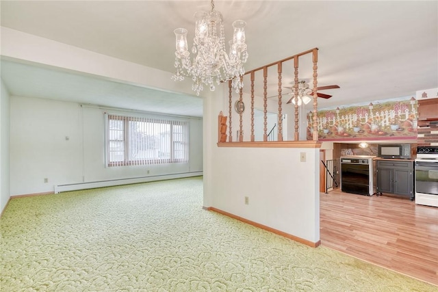 163 Auramar Dr, Irondequoit, NY 14609 - empty room with a baseboard heating unit, a chandelier, carpet, and a ceiling fan