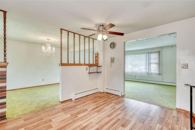 163 Auramar Dr, Irondequoit, NY 14609 - empty room featuring a baseboard heating unit, a ceiling fan, and wood finished floors