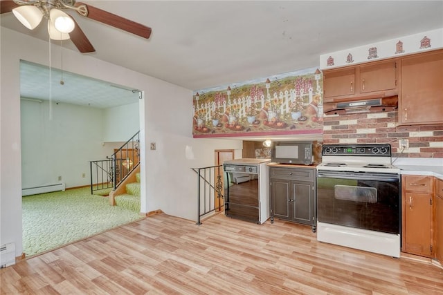 163 Auramar Dr, Irondequoit, NY 14609 - kitchen with electric range oven, under cabinet range hood, baseboard heating, black microwave, and light wood-style floors