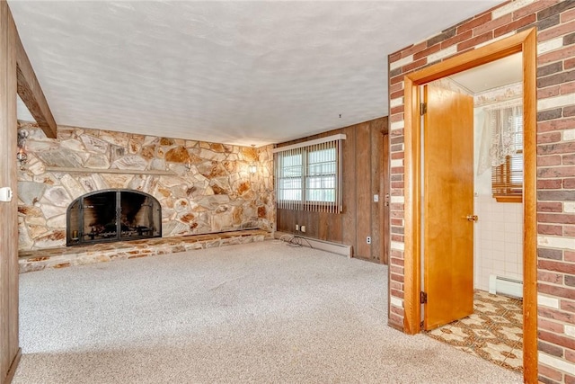163 Auramar Dr, Irondequoit, NY 14609 - unfurnished living room featuring carpet, a fireplace, a baseboard heating unit, and wooden walls
