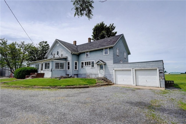 1621 Bragg St, Lima, NY 14485 - traditional home with a chimney, gravel driveway, a front yard, and an attached garage
