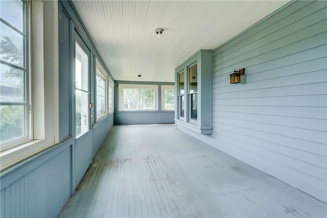 1621 Bragg St, Lima, NY 14485 - unfurnished sunroom with hardwood / wood-style flooring and wooden walls