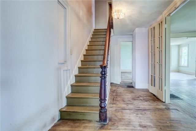 1621 Bragg St, Lima, NY 14485 - staircase featuring wood finished floors and french doors