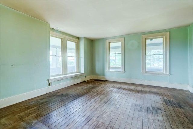 1621 Bragg St, Lima, NY 14485 - spare room featuring wood-type flooring and baseboards