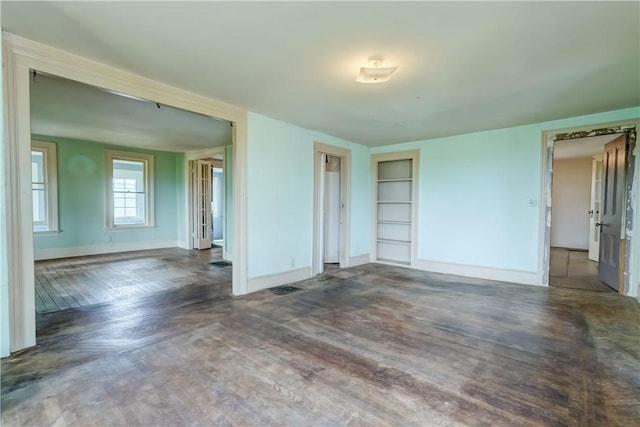 1621 Bragg St, Lima, NY 14485 - spare room with built in features and wood finished floors