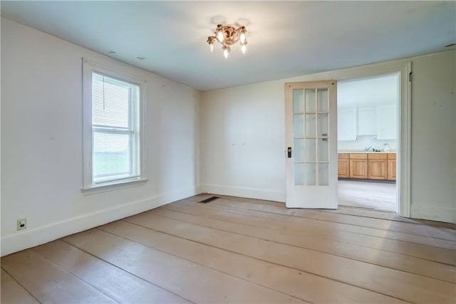 1621 Bragg St, Lima, NY 14485 - unfurnished dining area featuring light wood-style floors and french doors